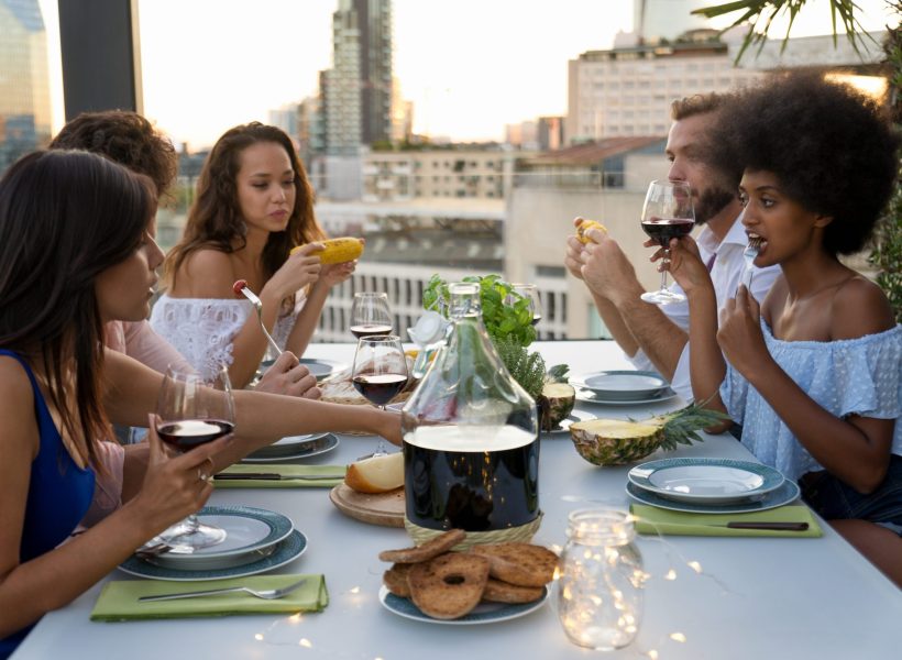 Multi-ethnic group of friends having party on  rooftop - Happy people bonding and having fun